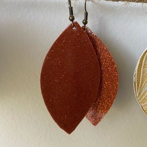 Orange sparkly earrings rust color